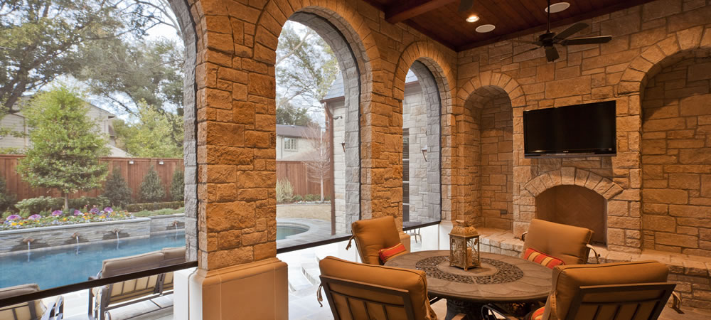 Beautiful Dallas, TX rock porch with motorized porch shades