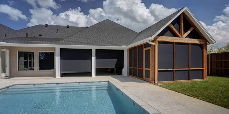 Dallas Texas patio with motorized shades and swimming pool.