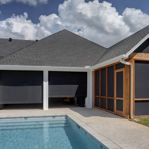Dallas, TX house with pool and motorized retractable patio shades.
