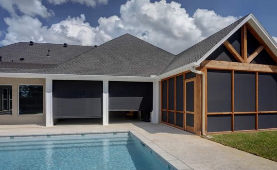 Dallas, TX house with pool and motorized retractable patio shades.